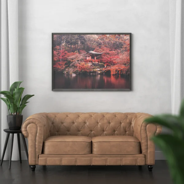 A serene Japanese autumn landscape with a red temple and bridge over a tranquil pond.