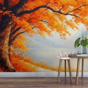 Autumn lakeside path wall mural with golden orange tree and tranquil blue lake.